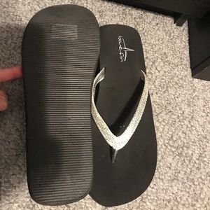 Silver glittery flip flops